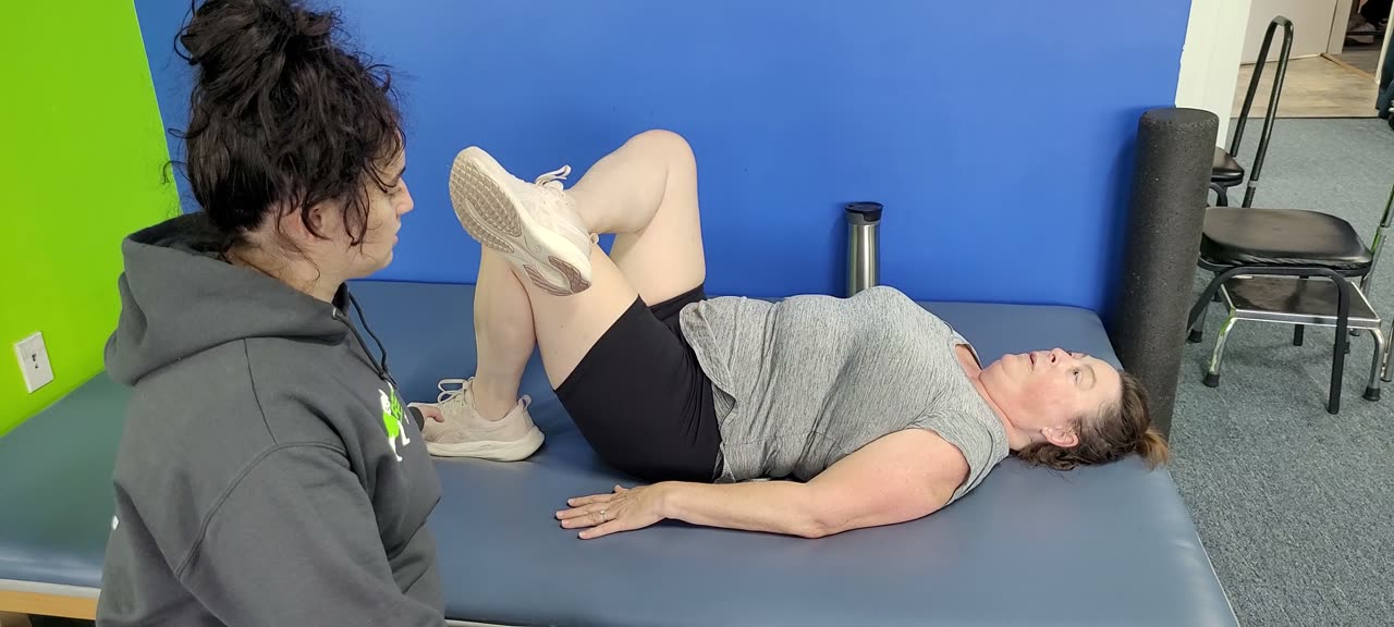 Client doing a guided bridge exercise after physical therapy
